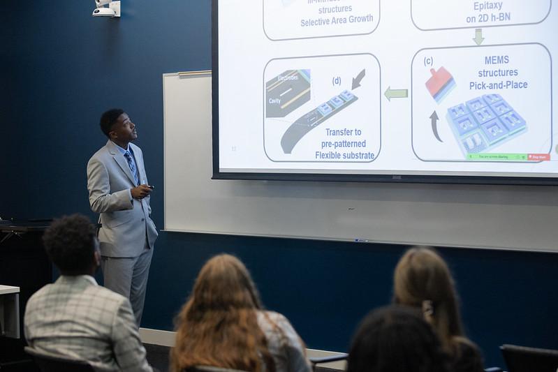 student presenting at 2024 SURE event